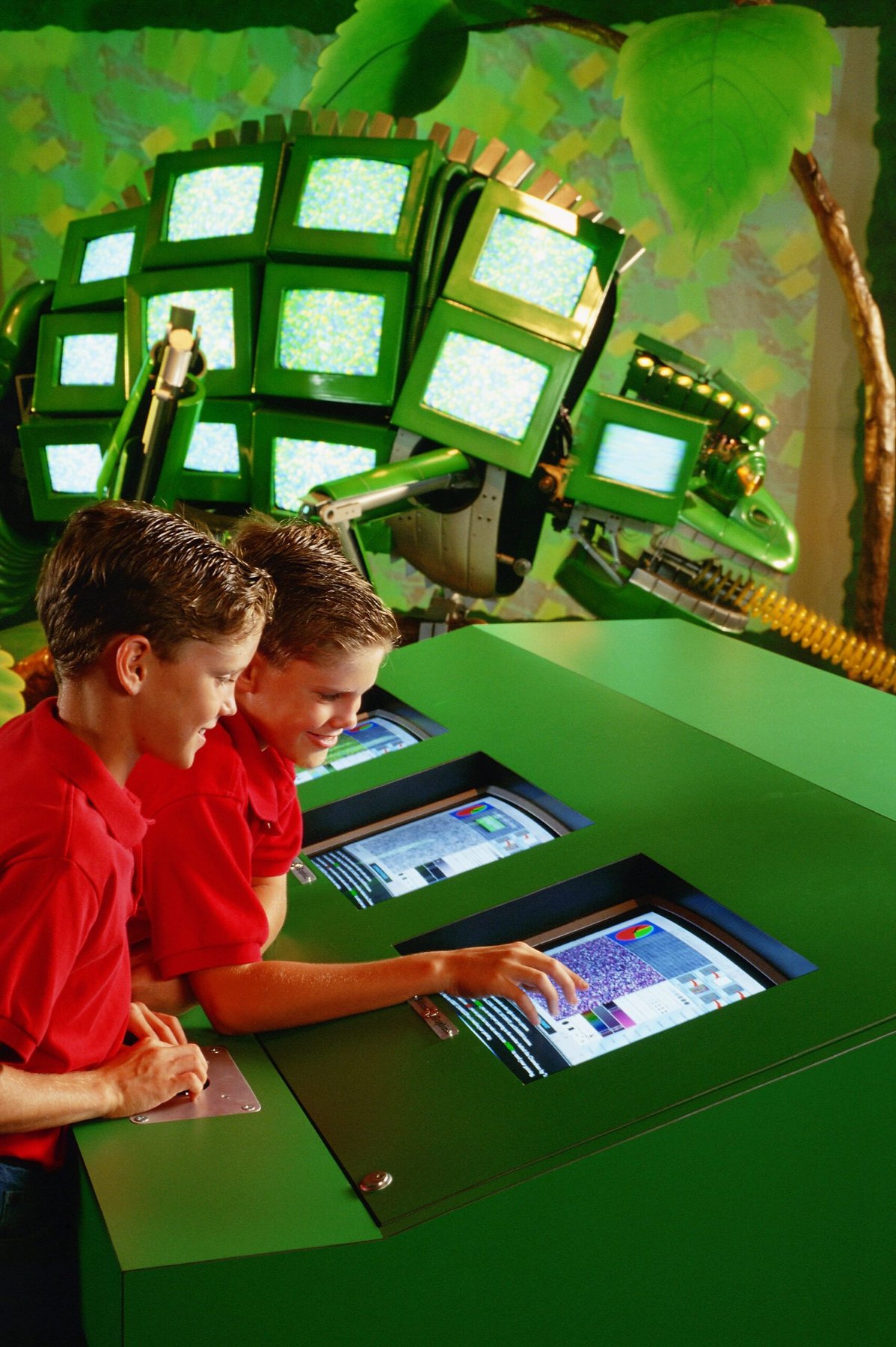 Kids at interactive consoles by The Robot Zoo chameleon