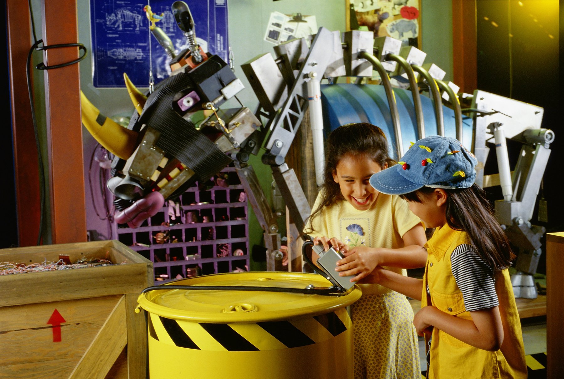 Kids at a hands-on station near The Robot Zoo rhinoceros